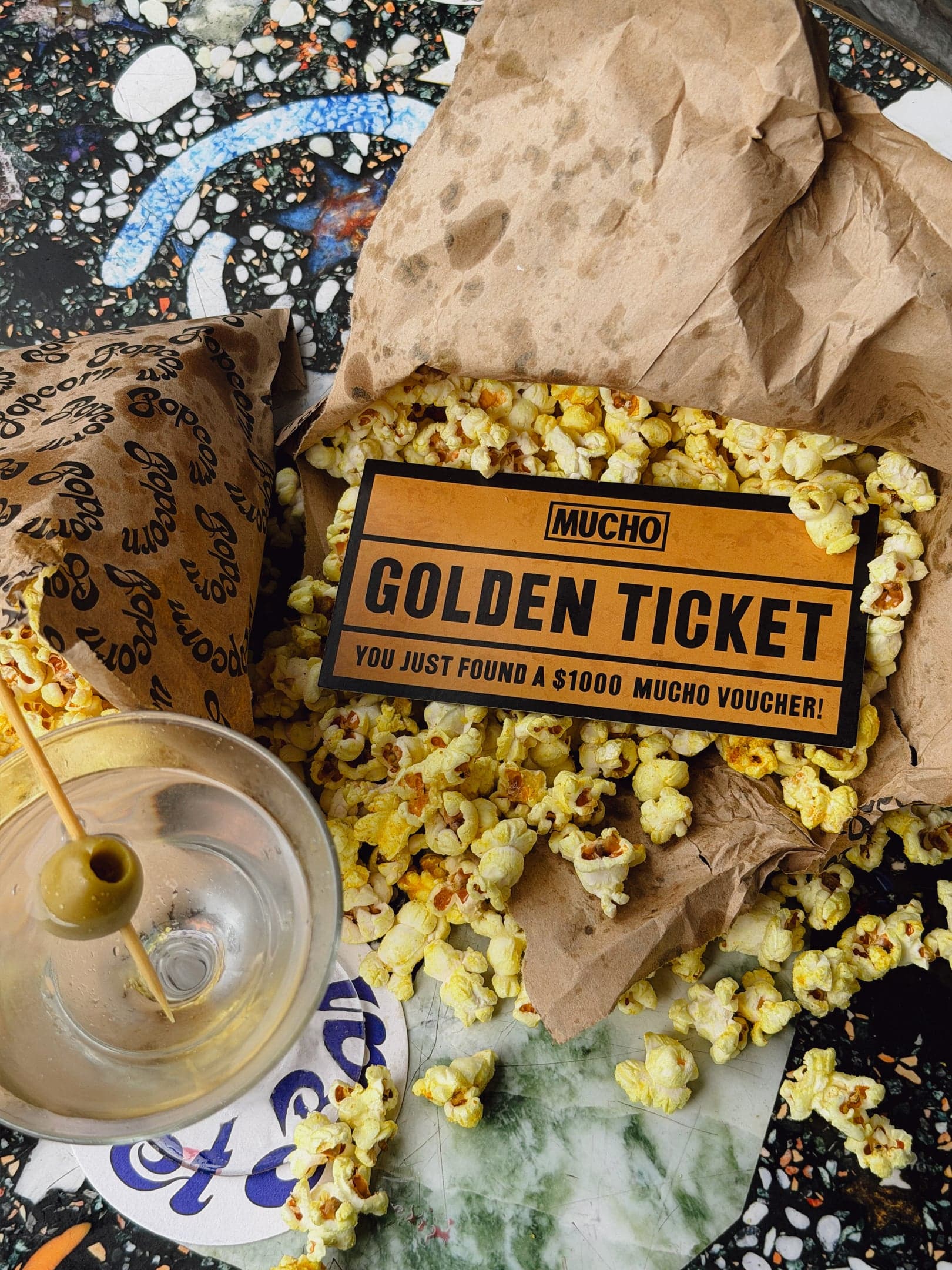 Mucho’s $1000 Golden Popcorn Ticket